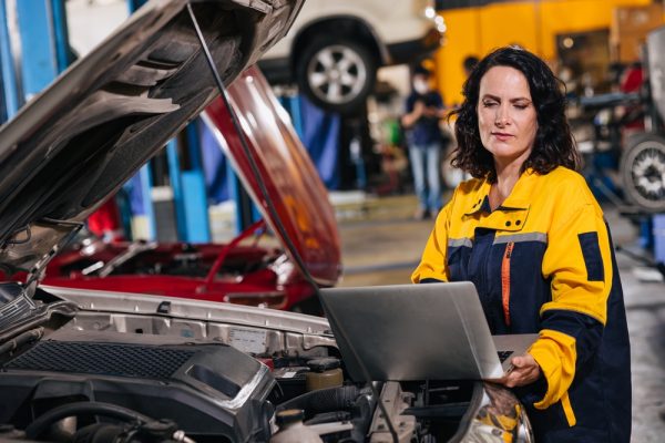 Mechanic performing computer diagnostics
