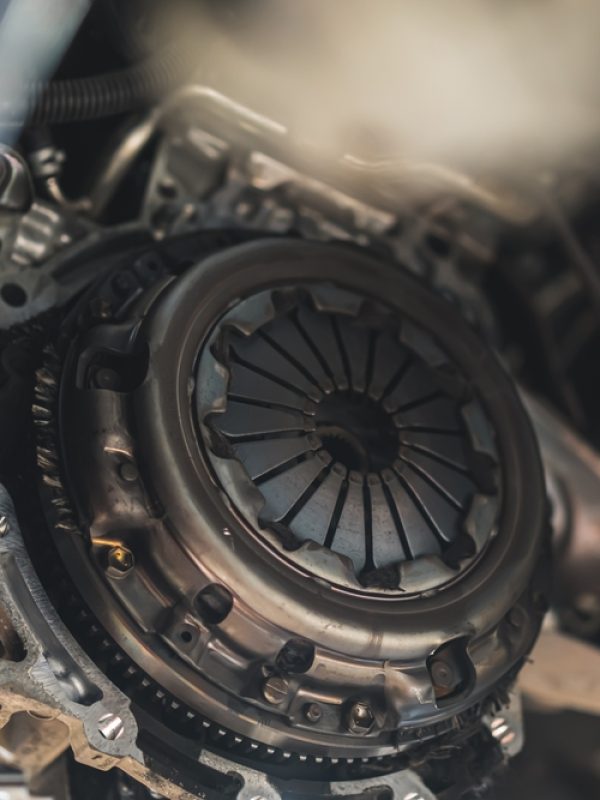 Duggy's Garage technician repairing car clutch