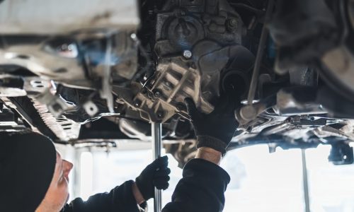 Duggy's Garage technician repairing car clutch