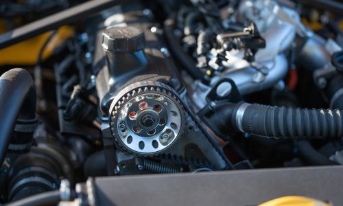 Closeup of a metallic timing belt of a car with chain