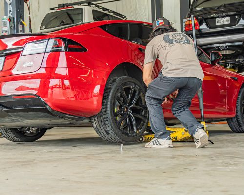 duggys-garage_GR2OMW-red-tesla-2 duggy's garage mechanic doing tesla service and repairs