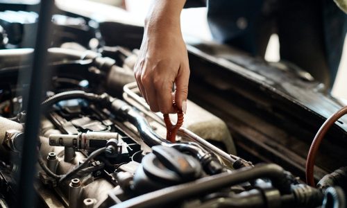 Car,,Hand,And,Mechanic,With,Person,In,Workshop,For,Maintenance, mechanic doing engine repairs
